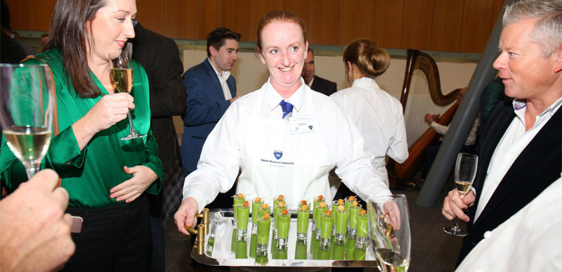 Diana Prosser, International Hospitality and Tourism student, serving a group of people at the Albert Roux dinner.