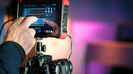 Close up of a high end digital camera with a touch screen for editing