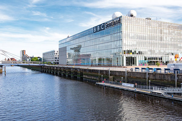 Panorama of the BBC Scotland building at the Pacific Quay, Glasgow on a sunny day