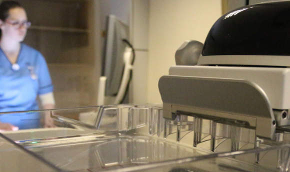 A Queen Margaret University student in a clinical lab