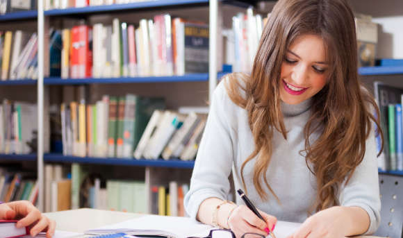 Queen Margaret University student studying in the library