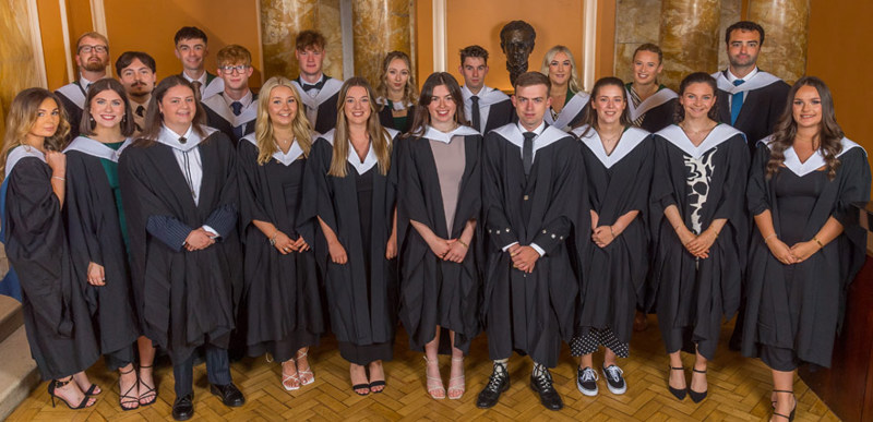 The first graduating class of students from the Initial Teacher Education course pose for a photo at graduation.