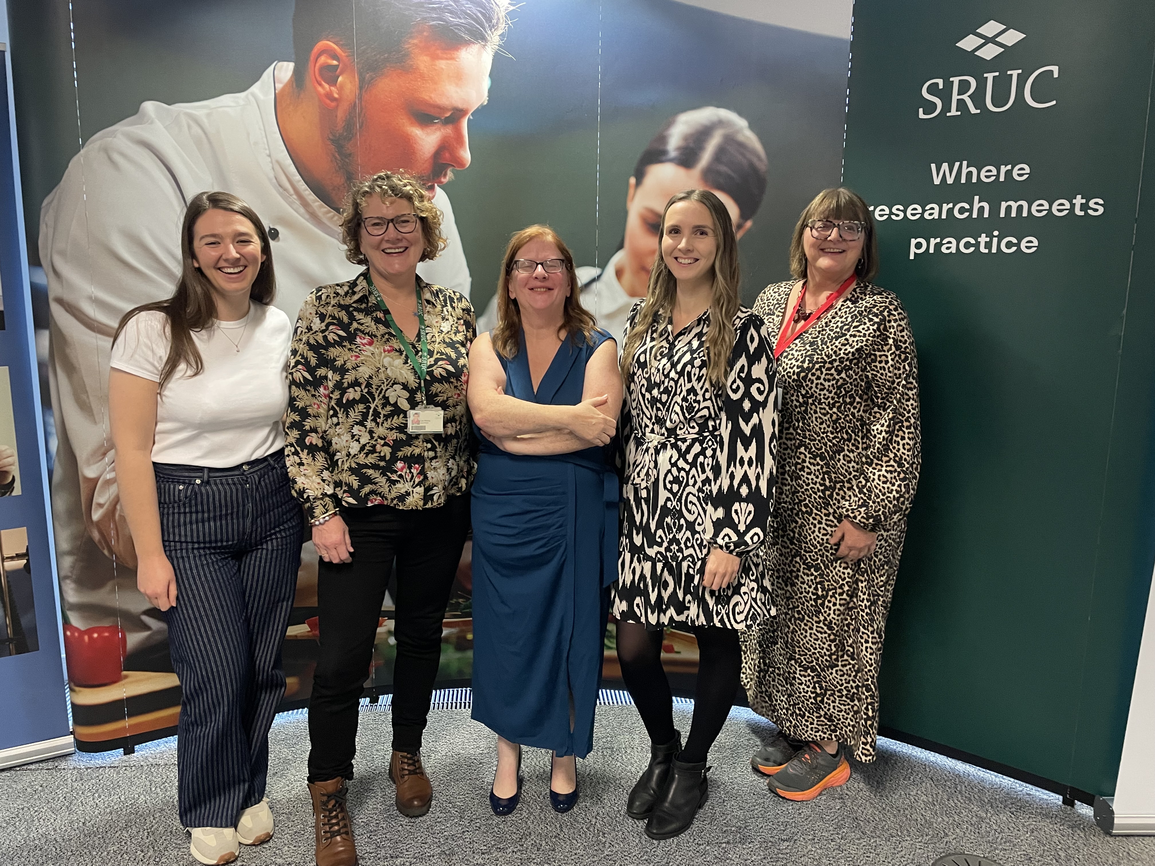 5 woman standing smiling