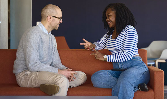 A student speaking to a member of the Student Services team.