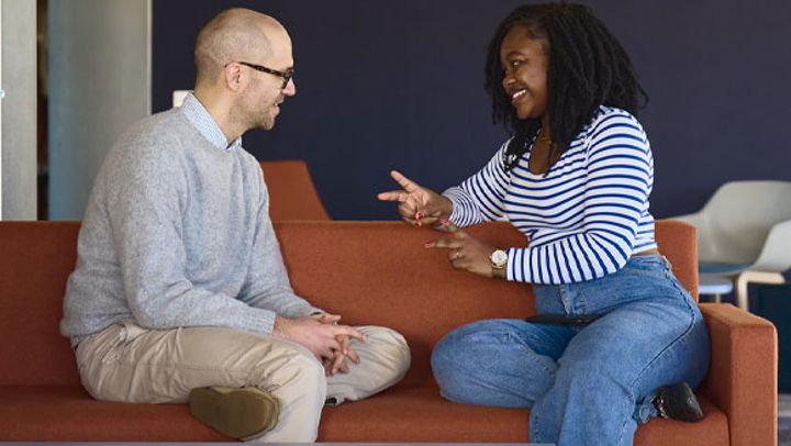 A student speaking to a member of the Student Services team.