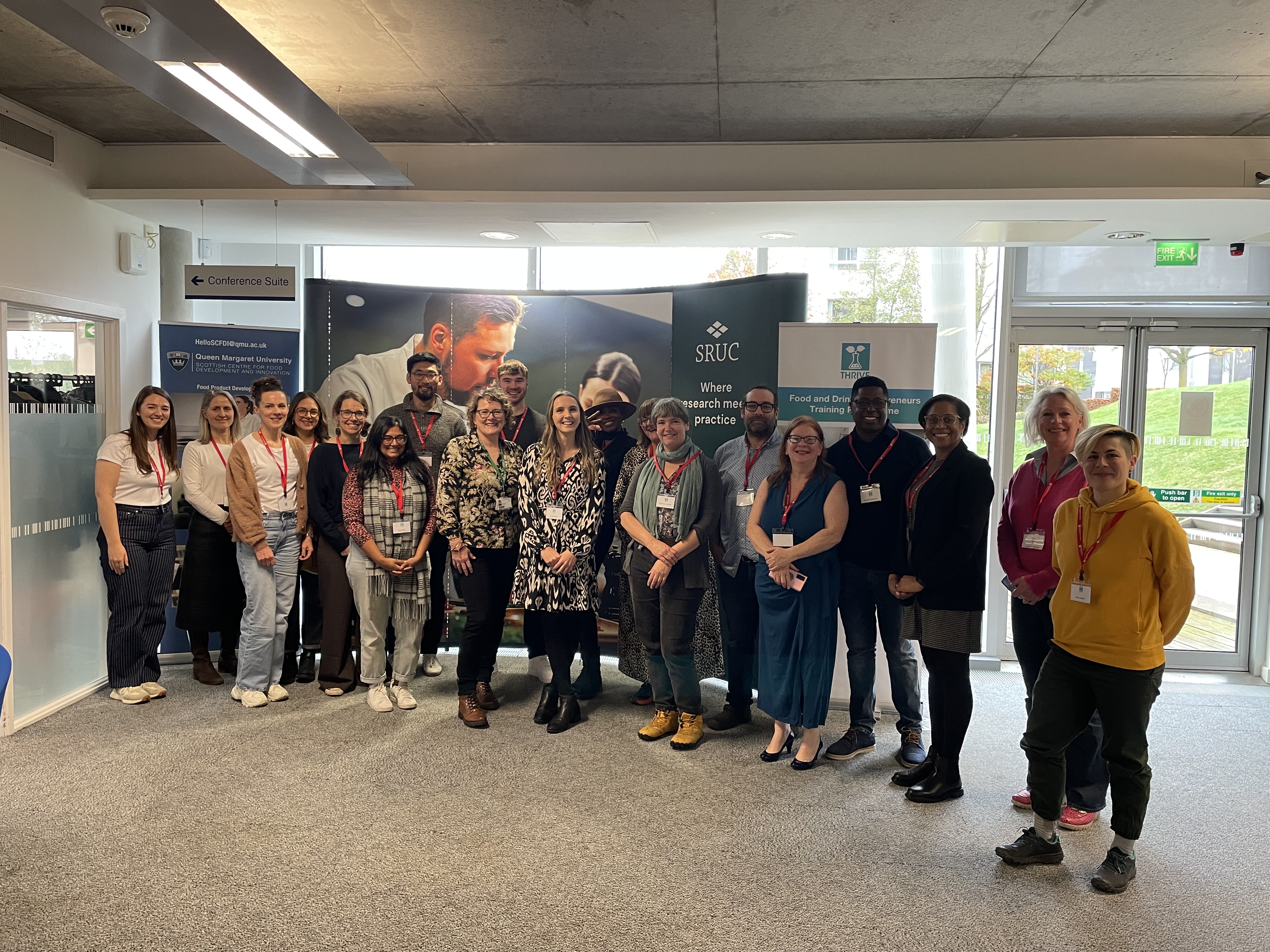 19 people smiling at camera