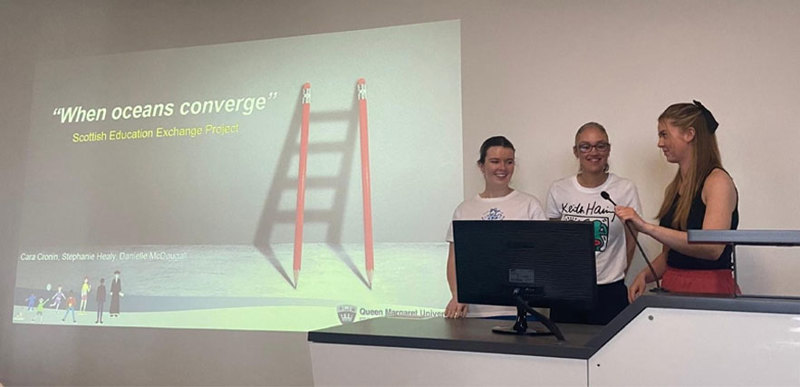 Three students delivering a group presentation