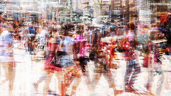 Abstract image of lots of people walking in the street