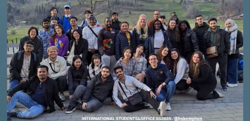 A group of people posing for a photo together.