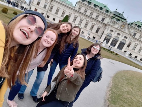 Image of Alexandra taking a selfie with friends