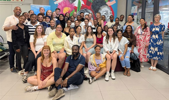 A large group of people posing for a photo together