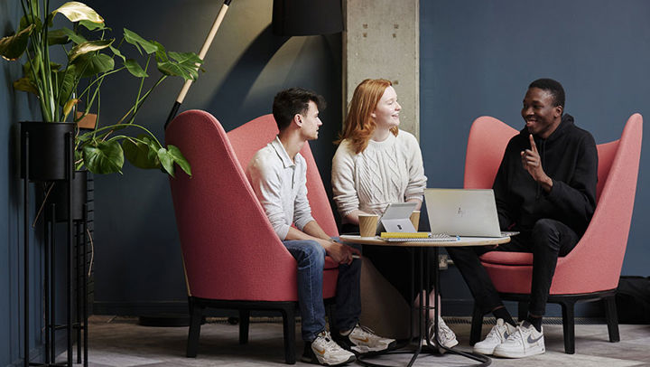 Business colleagues sitting around a table chatting