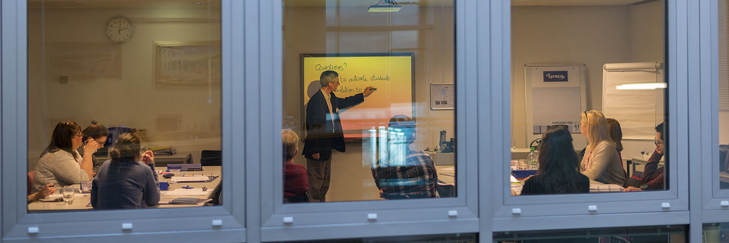A class in session, photographed from outside at QMU campus