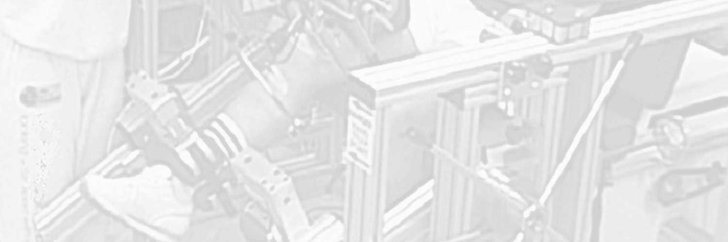 Greyscale photo of someone with their leg in some sort of medical machinery