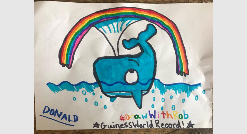 A drawing of a whale with a rainbow overhead