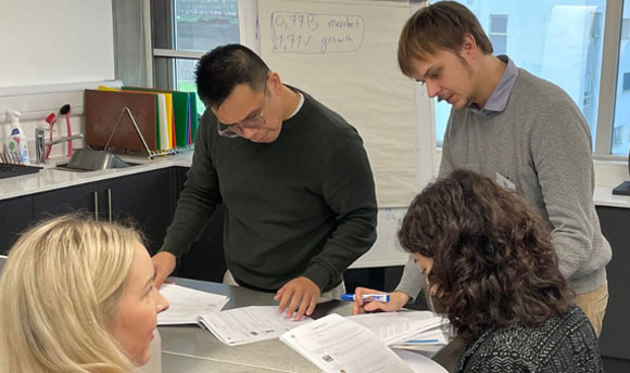 Students learning in a group at the THRIVE training session