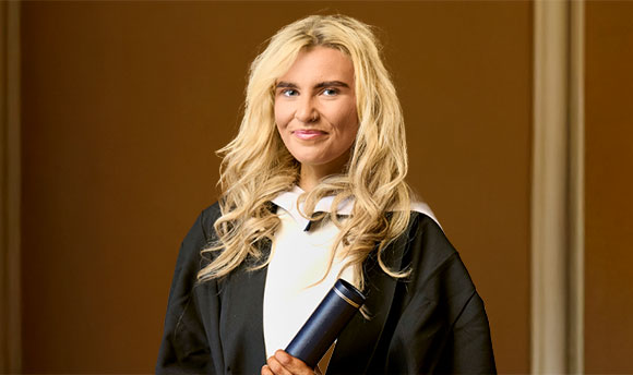 Kaleigh Doran in graduation robe