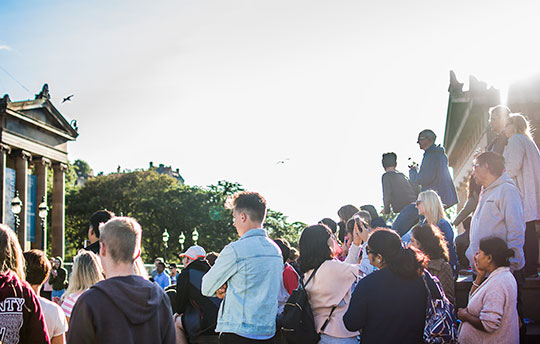 People watching street performance in Edinburgh