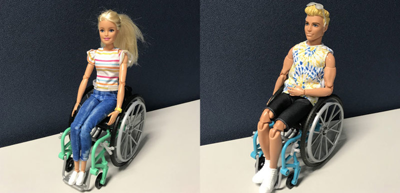 A collage image of a Ken doll and a Barbie doll, both seated in wheelchairs.