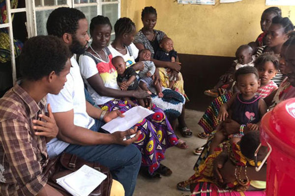 Doctoral researcher Jawo Bah collaborating with mothers in Sierra Leone to adapt the Friendship Bench intervention for addressing postnatal depression in community settings